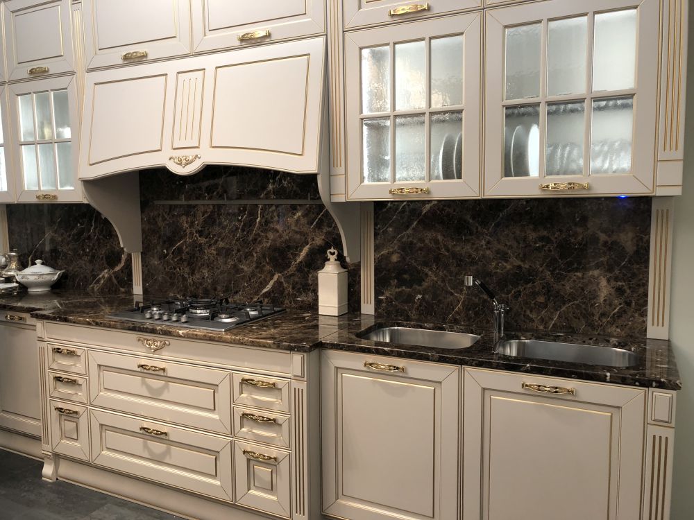 Luxury kitchen with brown dark counteropt and white cabinets