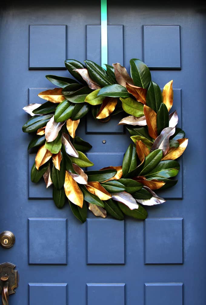 Stylish wreath made of painted magnolia leaves