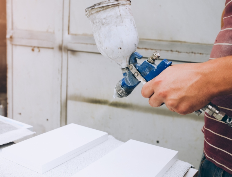 Man with a sprayer gun