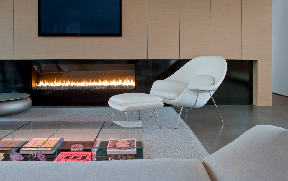 The elegant design of the chair makes it work in any space.  Here, it is a perfect addition to the living room, but is still cozy enough to be an inviting fireside seat.