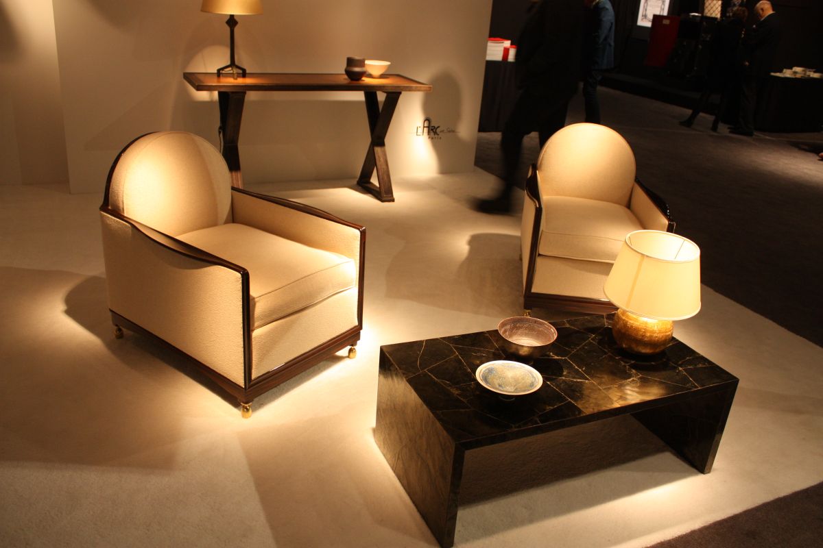 Marble coffee table and two cream armchairs