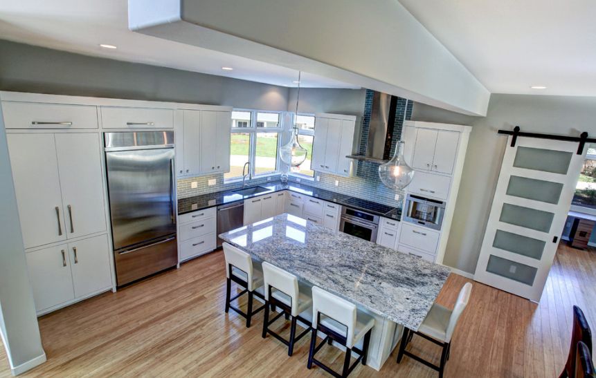 Marble countertop island and bamboo floor