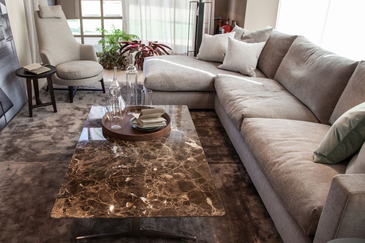 Marble top coffee table in front of sofa