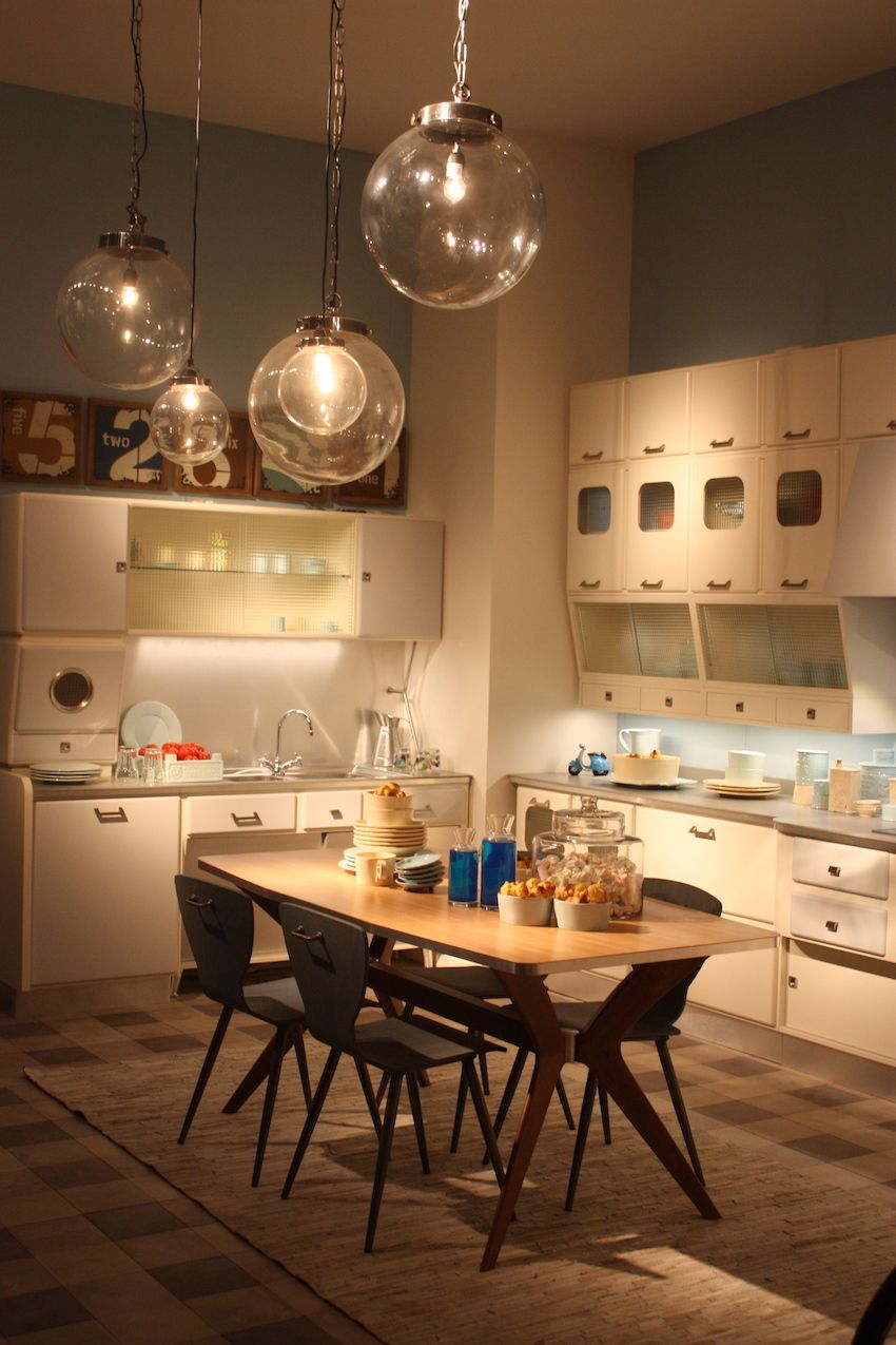 A retro style kitchen like this one by Marchi is the perfect place for clear glass globe pendants in varying sizes. Kitchen pendant lighting like this is versatile, thanks to the glass and minimalist style.