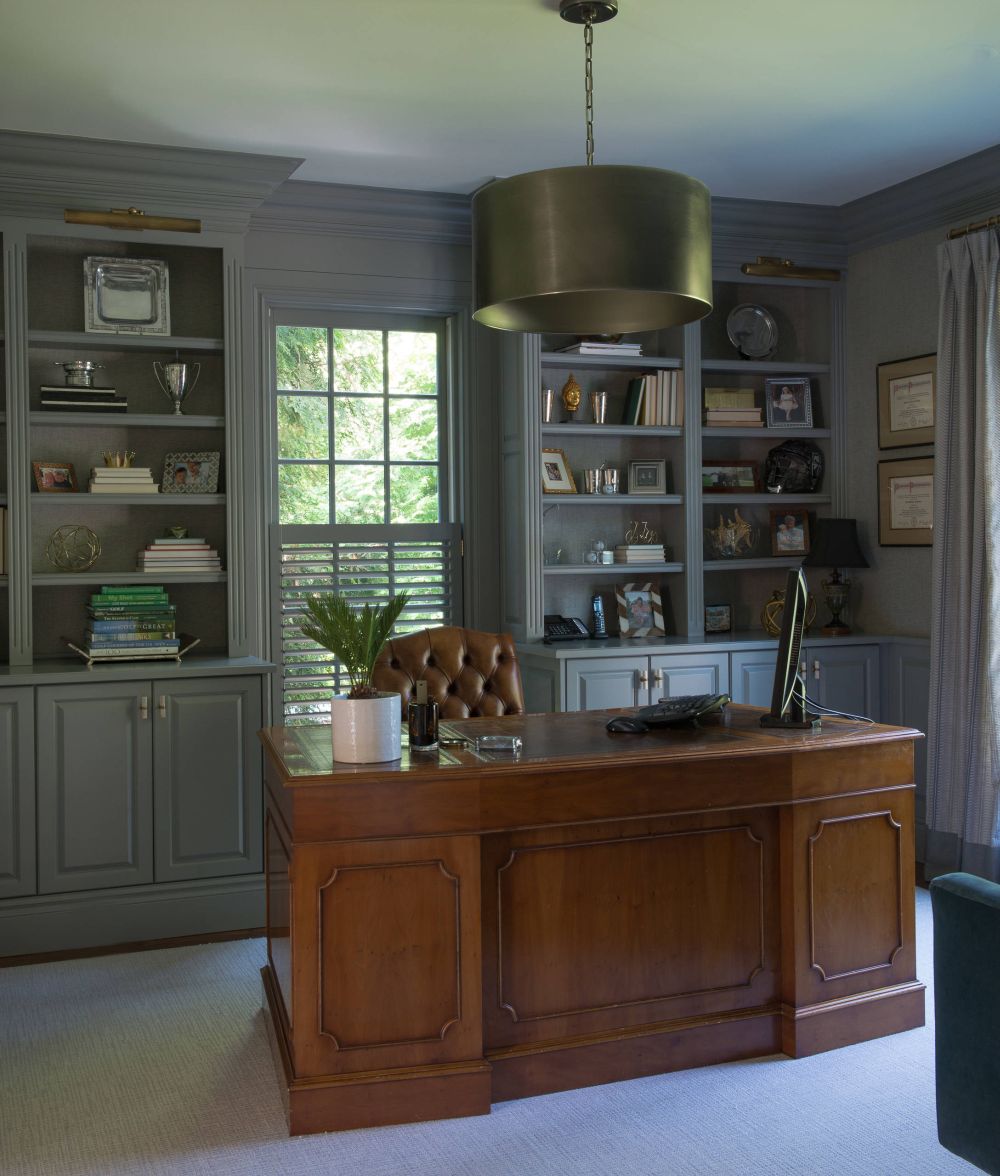 Masculine office with a gray interior design and executive leather chair