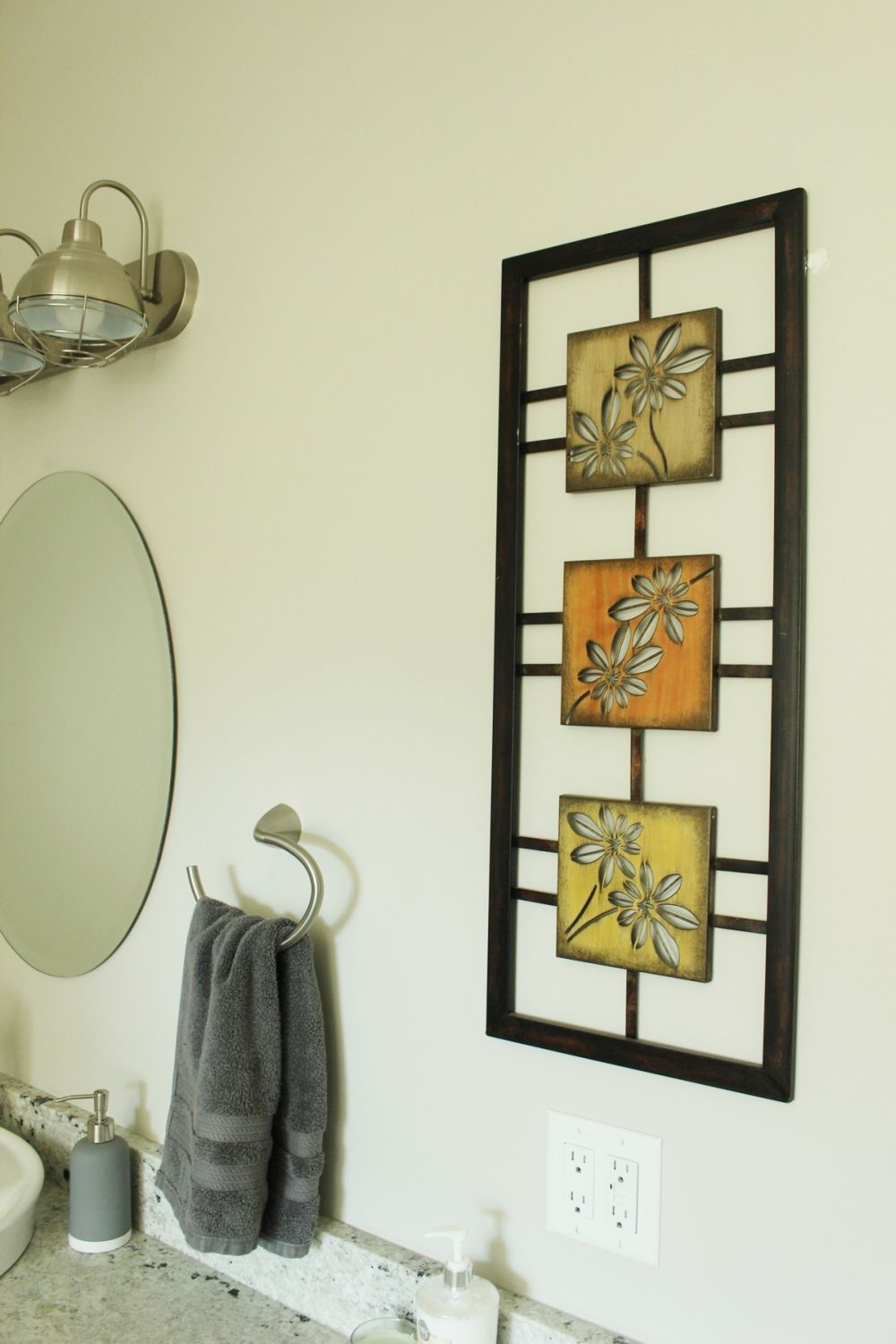 Master bathroom with metal wall art