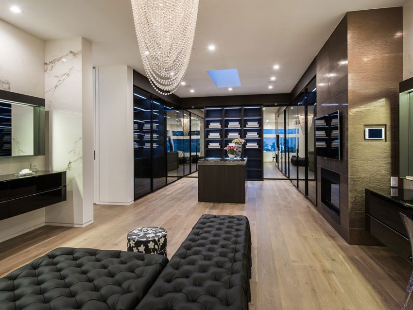 Master bedroom with walk in closet tufted leather seating