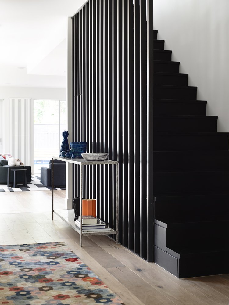 Melbourne House featuring a modern black staircase