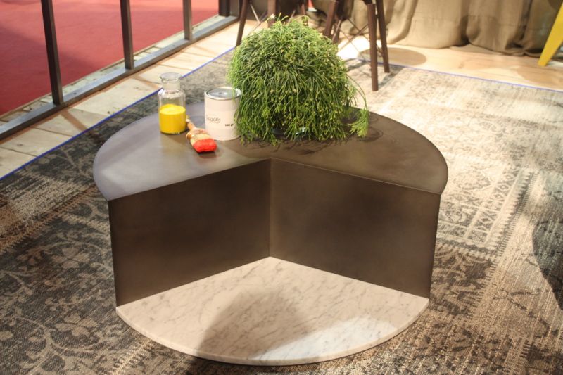 It may look like a cake missing a slice, but this Coco coffee table from Colico is not missing any style. The marble base in the front anchors the metal section, which has a single metal support underneath. Turned toward a sofa, the table makes the room feel more open because it does not have a full, large round top.