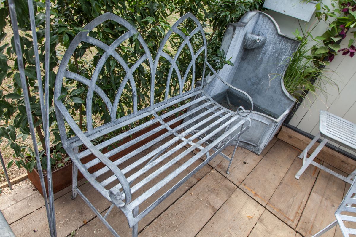 Metal is one of the most common materials that garden benches are made of