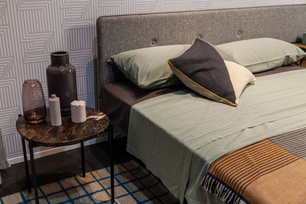 Metallic legs and brown marble for bedside table
