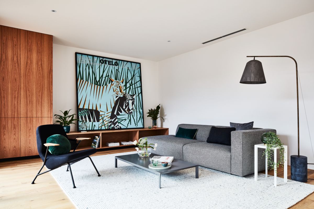 Mid century living room with grey sofa and arc lamp