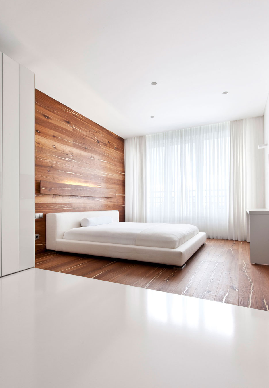 Minimalist bedroom with wall paneling