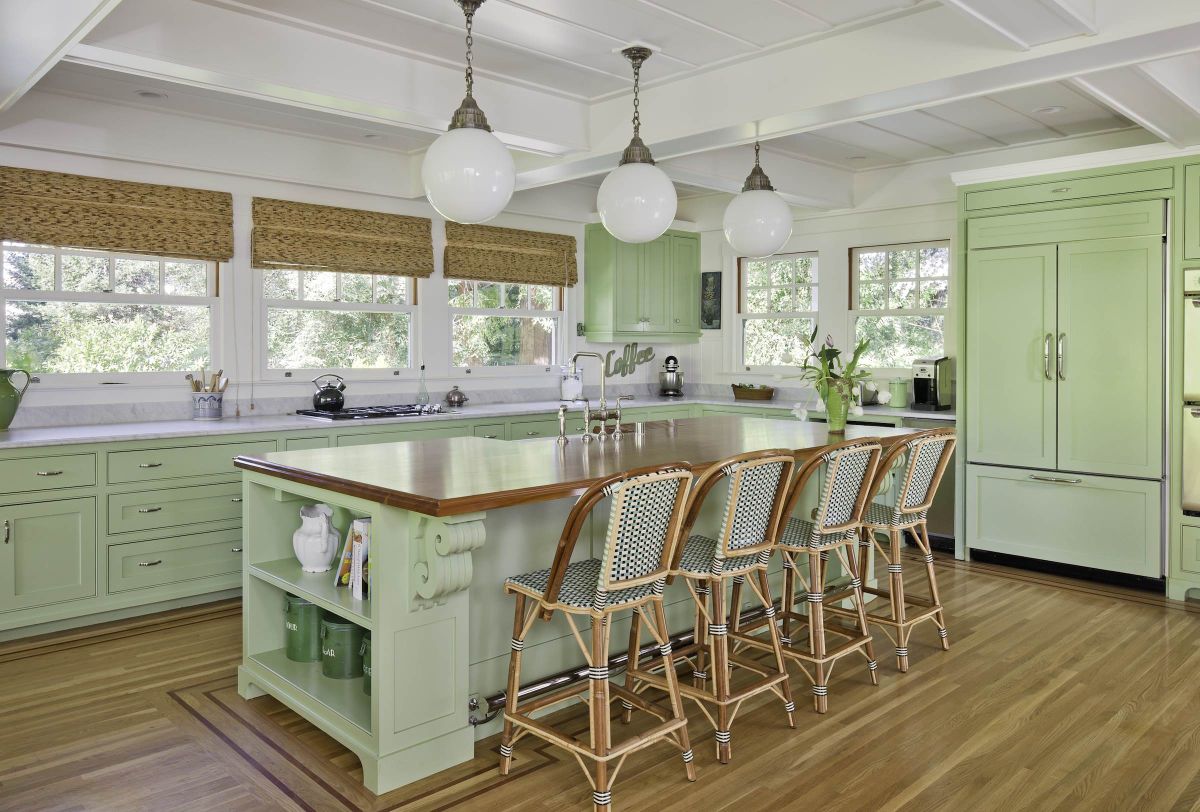 Mint green kitchen cabinets with bistro bar stools