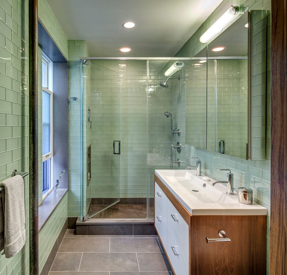 Mint green subway tiles and walk in shower