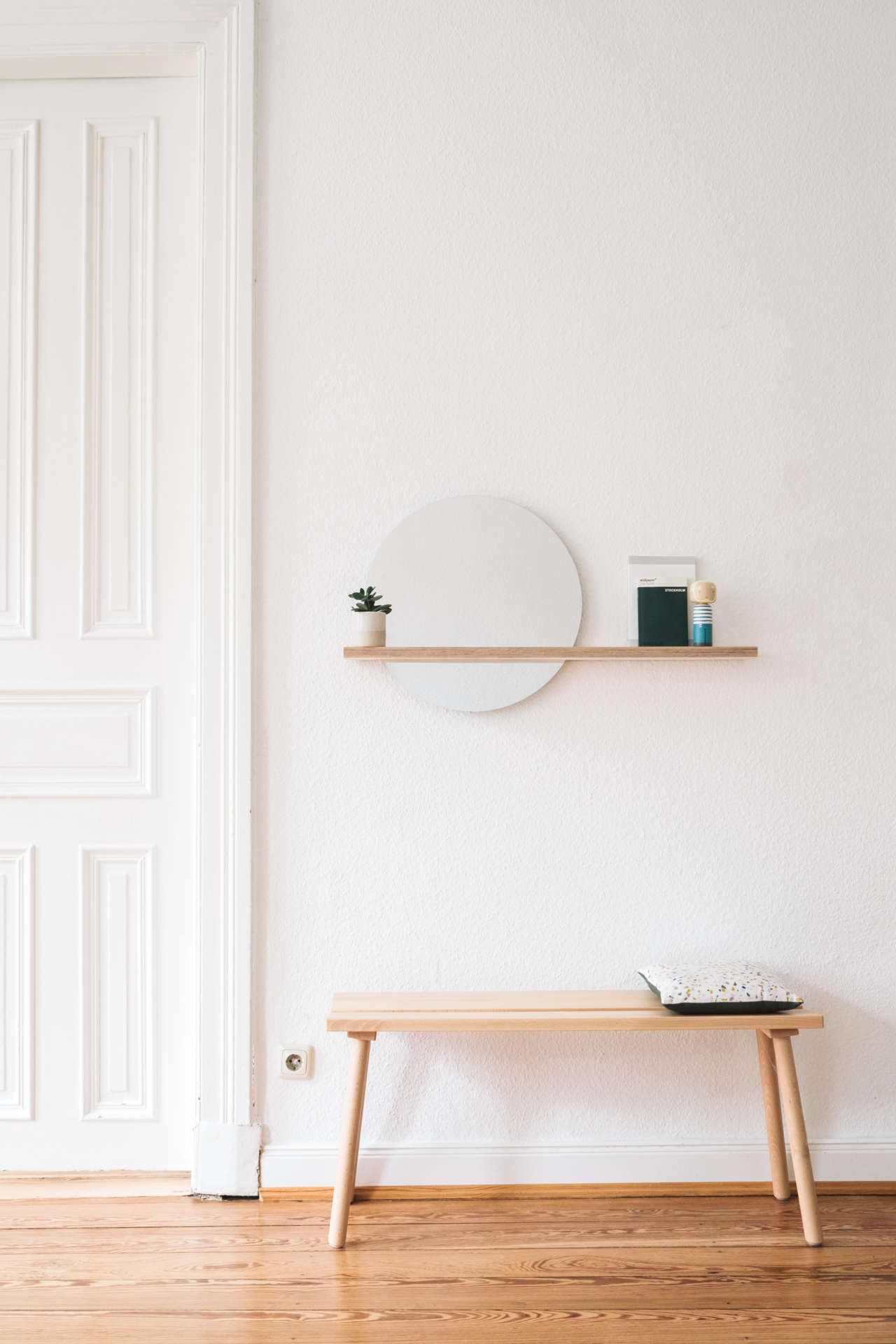 Combine the mirror with a stylish shelf