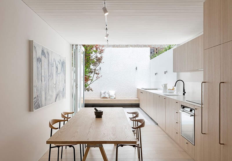 An indoor kitchen then extends outside