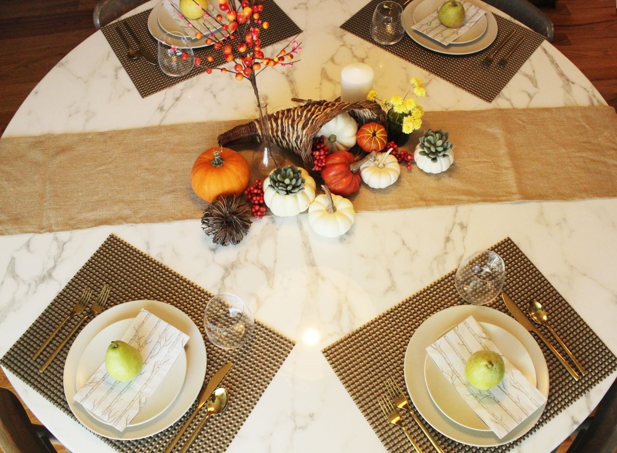 Modern Thanksgiving Table Setting - A place setting in which a pear fruit