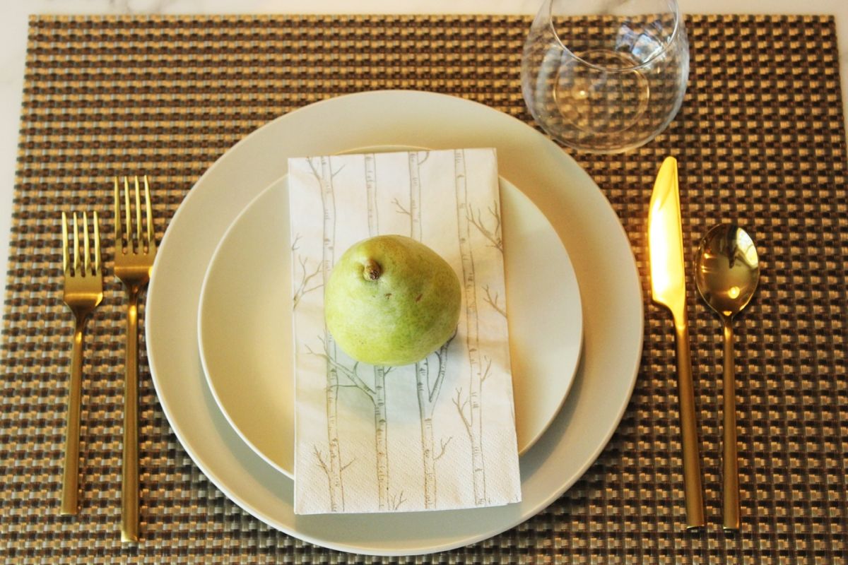 Modern Thanksgiving Table Setting-Perhaps a simple pear resting atop a printed napkin