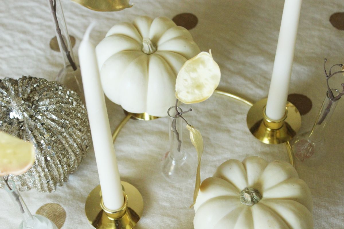 Modern Thanksgiving Table Setting-centerpiece holds to the cream and gold color palette