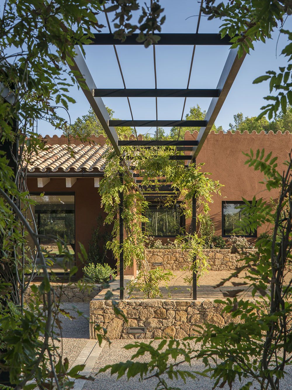 Modern arbors add plantings to the view right out the window