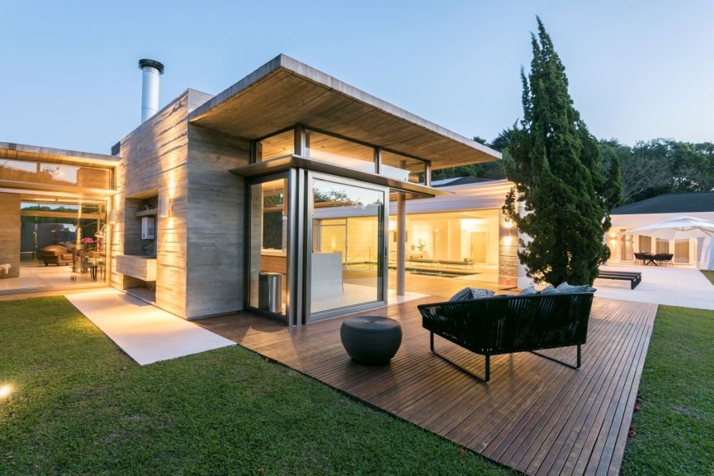 Modern backyard design with deck and fireplace