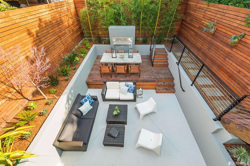 Modern backyard design with kitchen and dining table