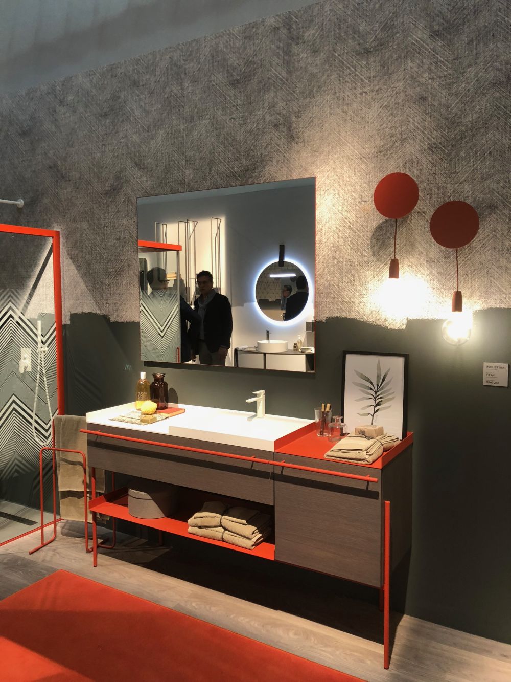 Modern bathroom with stripes of orange and unfinished grey paint