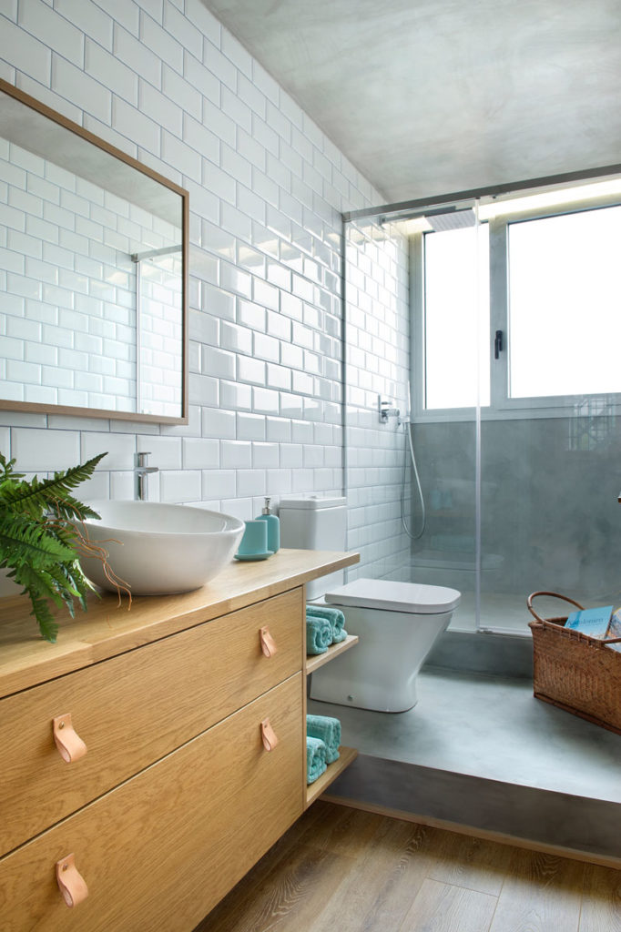 Modern bathroom with subway tiles and walk in shower