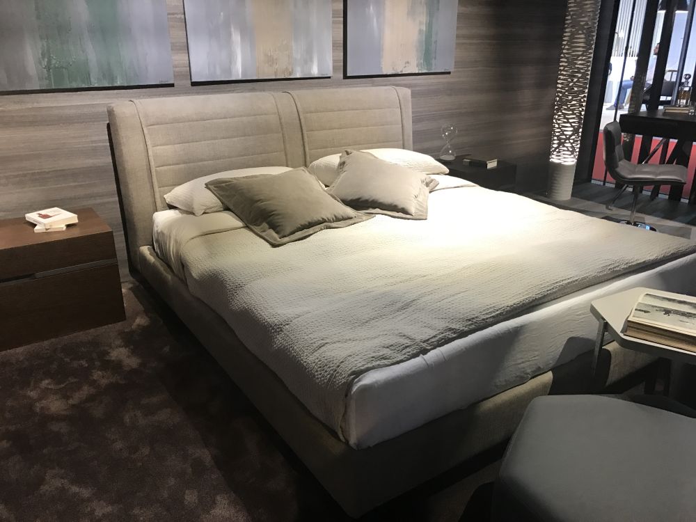 Modern bedroom with arts on the wall and gray accents