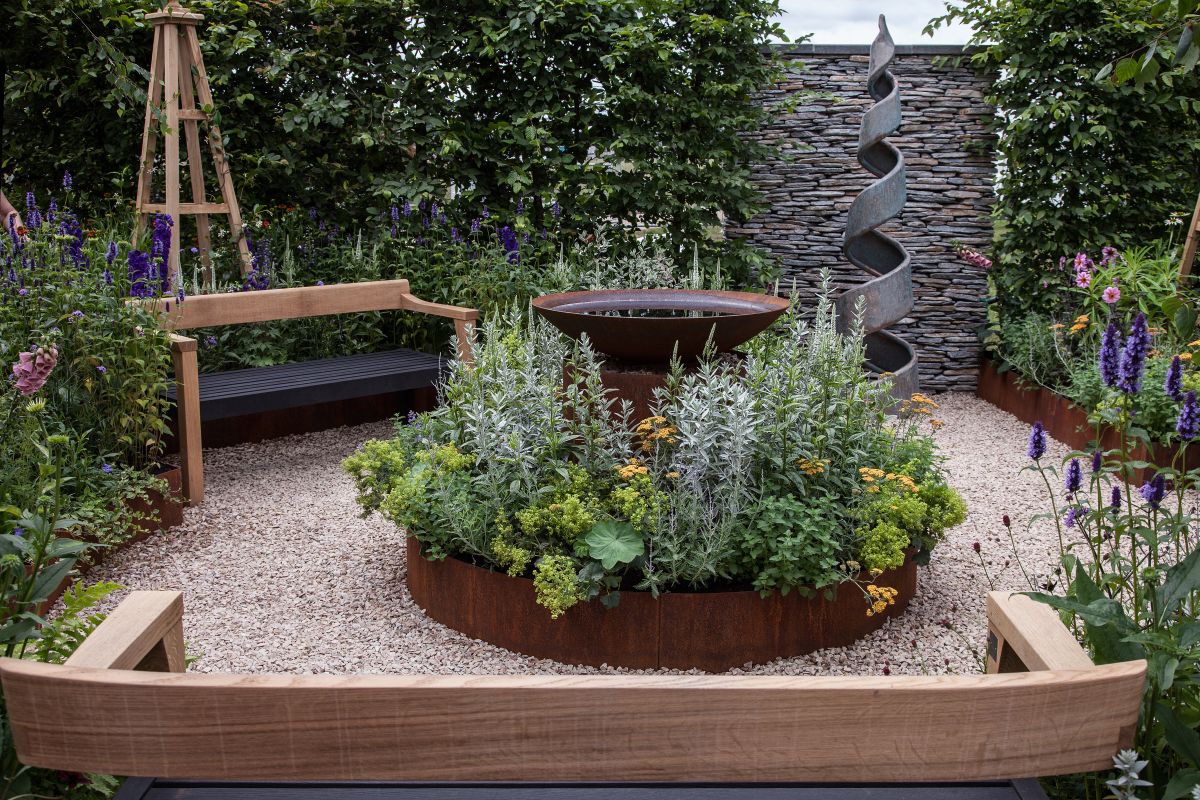 Place a bench at the far end of your garden so anyone would wants to sit down has to first explore the garden