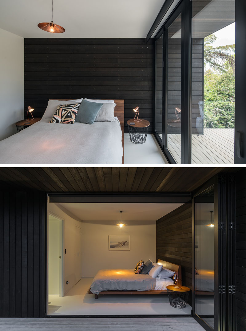 Modern black bedroom with deck balcony