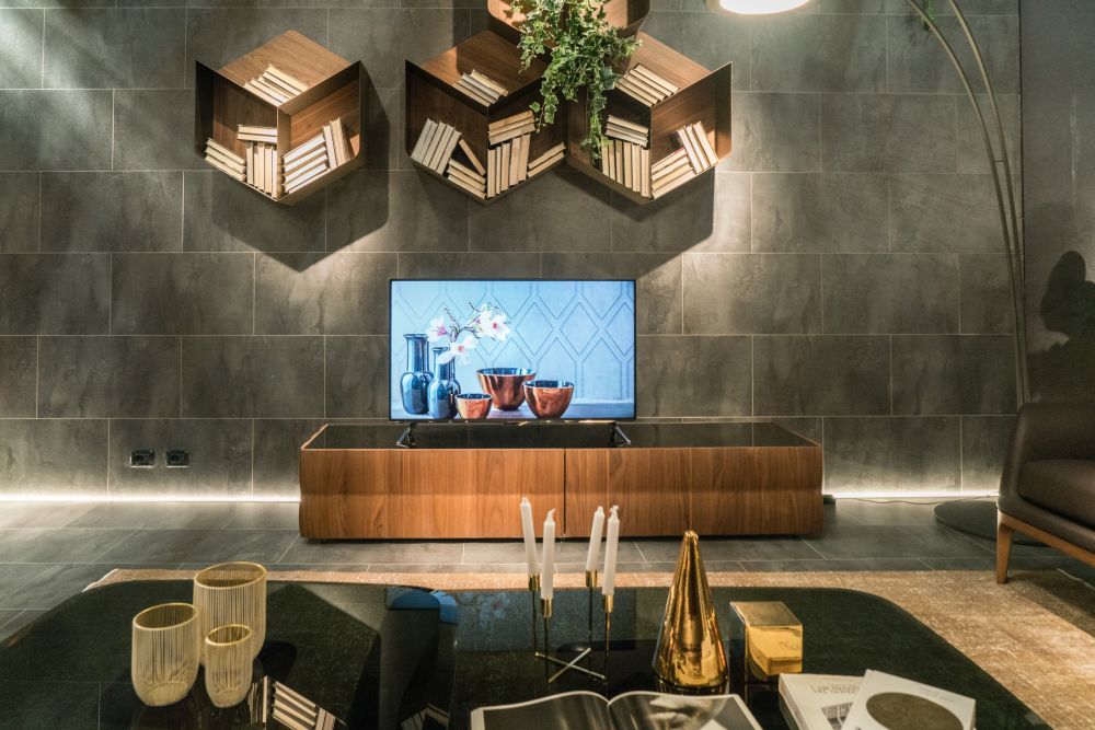 Modern hexagon shelves on the wall above tv