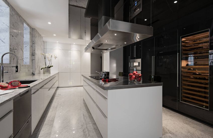 Modern kitchen design with marble walls and floor