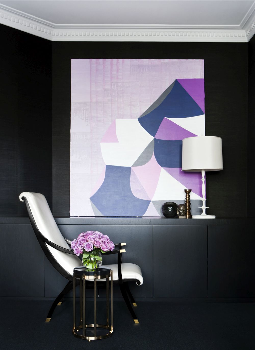 Modern living room in dark color with levender artwork