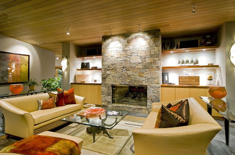 Modern living room with stacked fireplace stone design