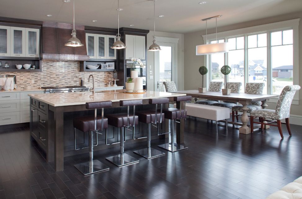 Modern open space kitchen with dining area featuring a trestle table