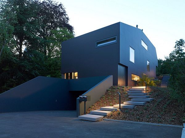 Modern villa with a black facade