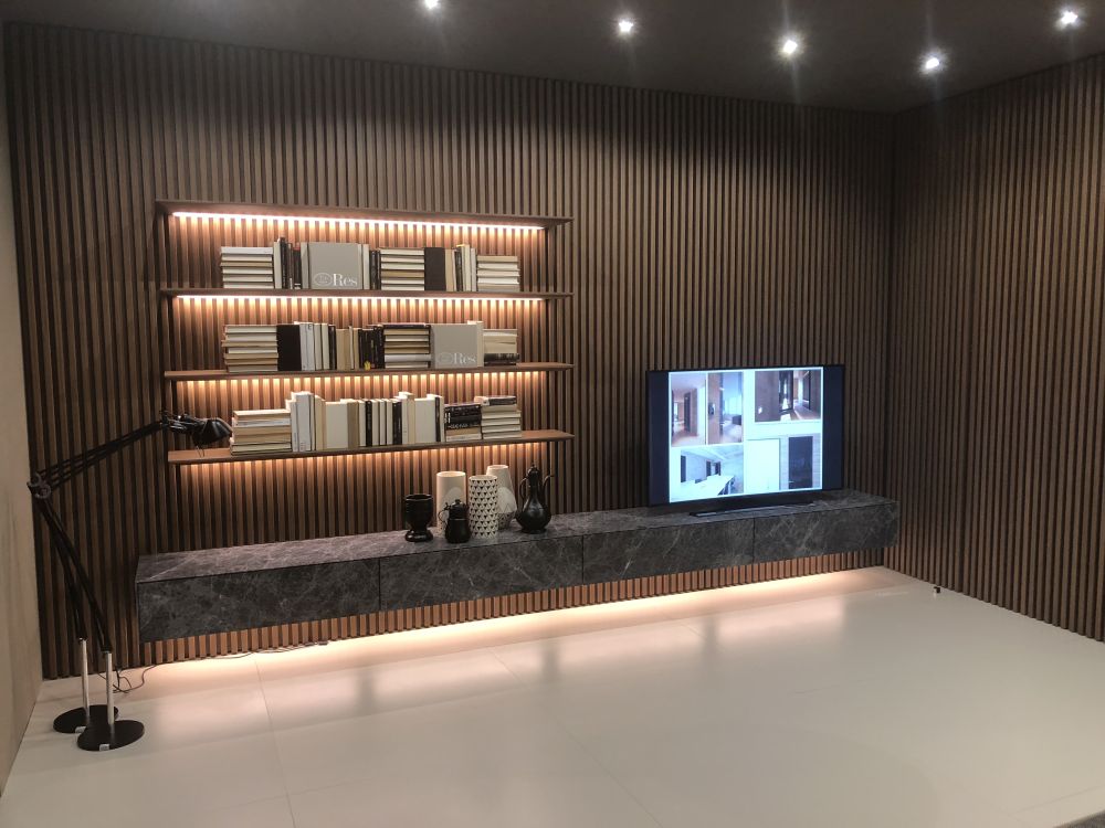 Modern wall living room design with floating shelves and LED light