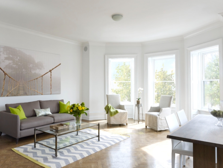 Modern white living room with bay windows