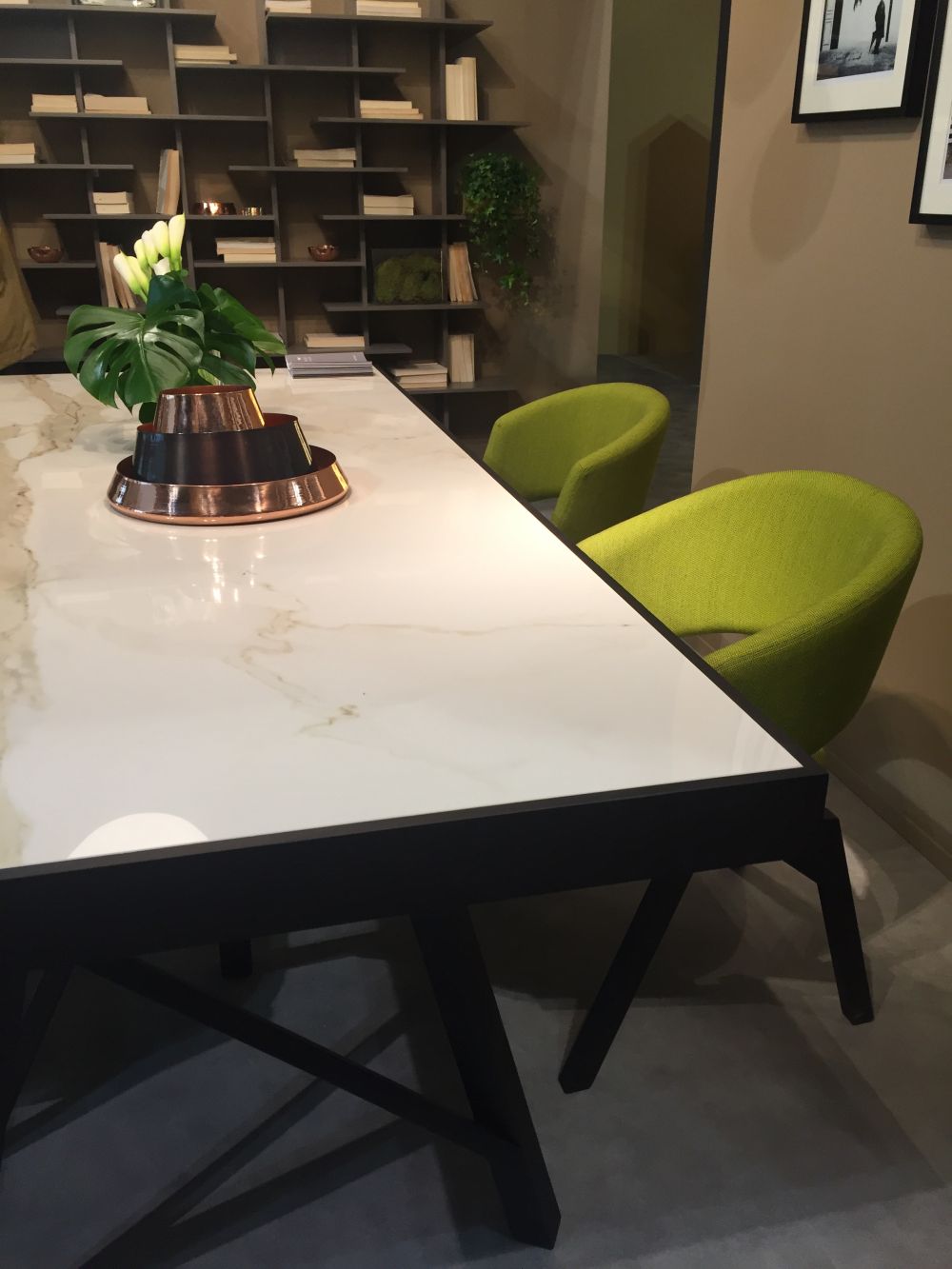 Modern white marble top table and green upholsterd chairs