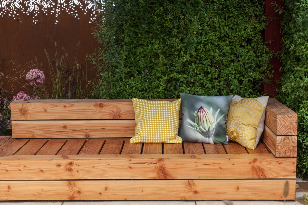 A garden bench can be built out of various different materials and wood is a pretty common option