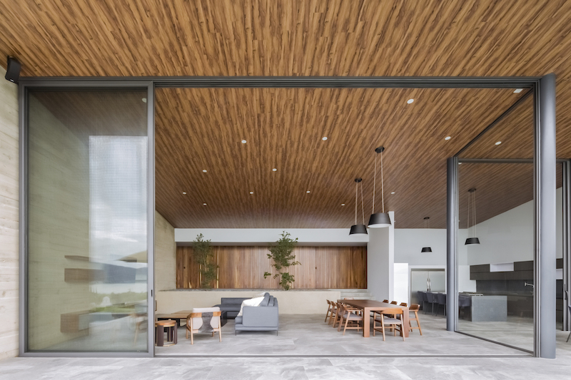 Modest Lake House - high ceiling living room