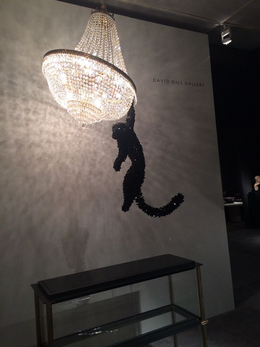 Artist Barnaby Barford created this jeweled monkey hanging from a large chandelier, yielding a kitchsy lighting fixture.