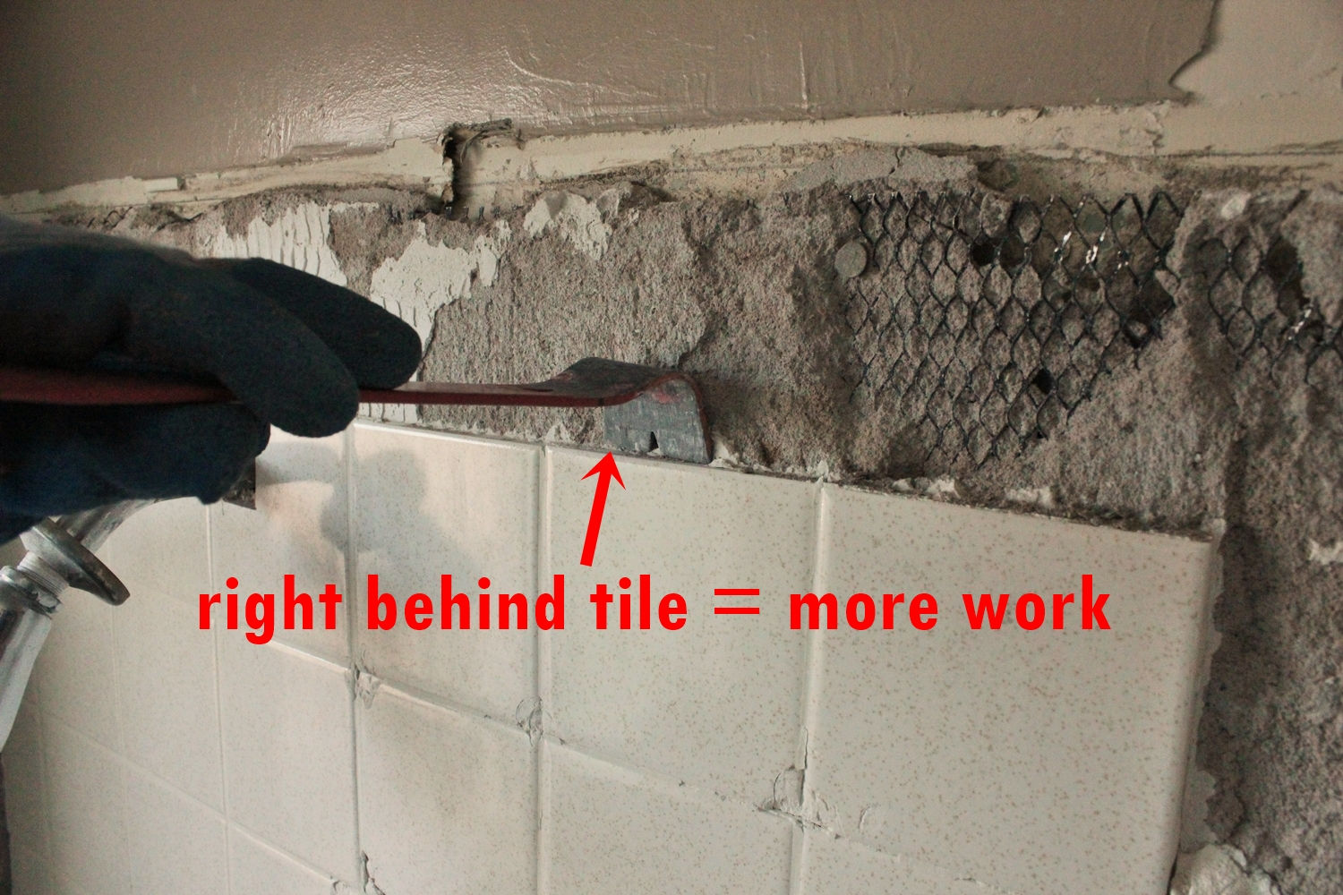 Mortat intact behind tiles