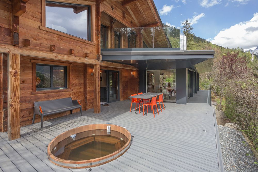 Mountain cabin with wood backyard deck and sunken sauna