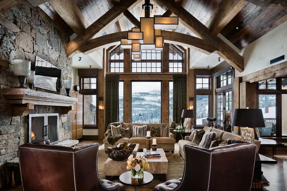 Mountain rustic chalet with large fireplace and tv above