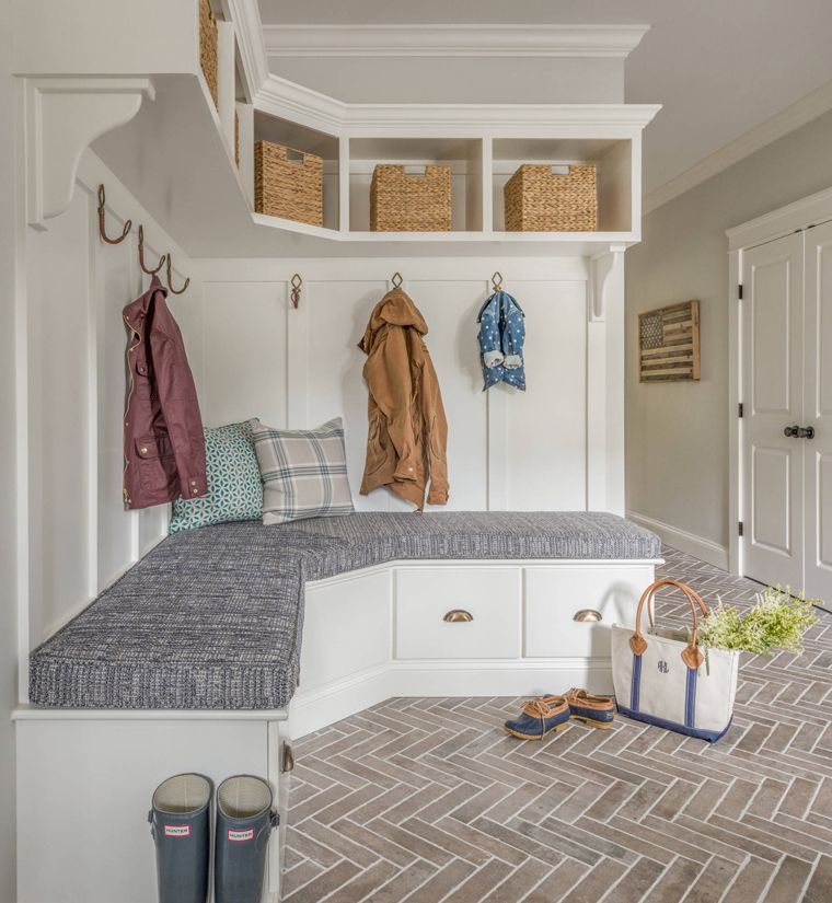 Mudroom with corner hall tree and chevron brick floor