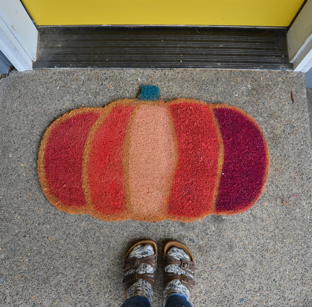 Multicolored pumpkin doormat