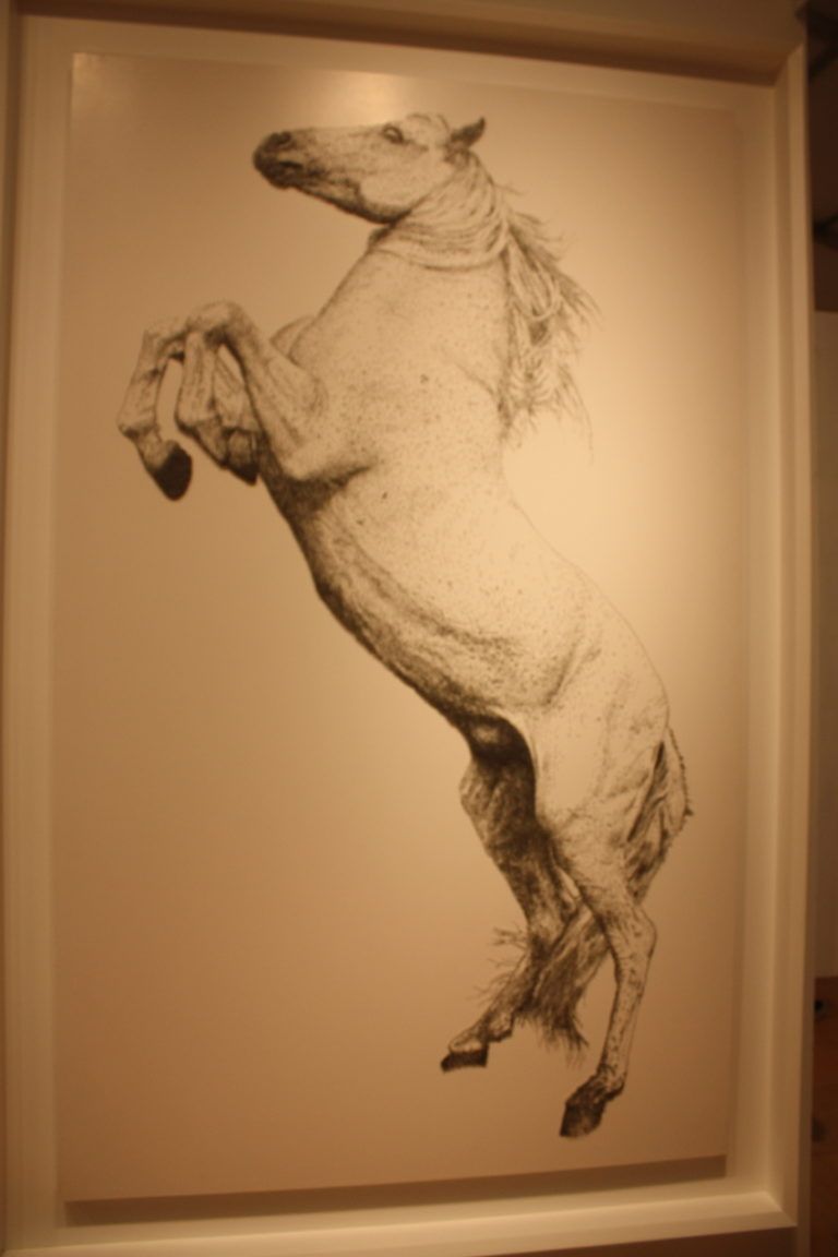 The details shading in the work are so precise it is difficult to believe it's composed of nails.